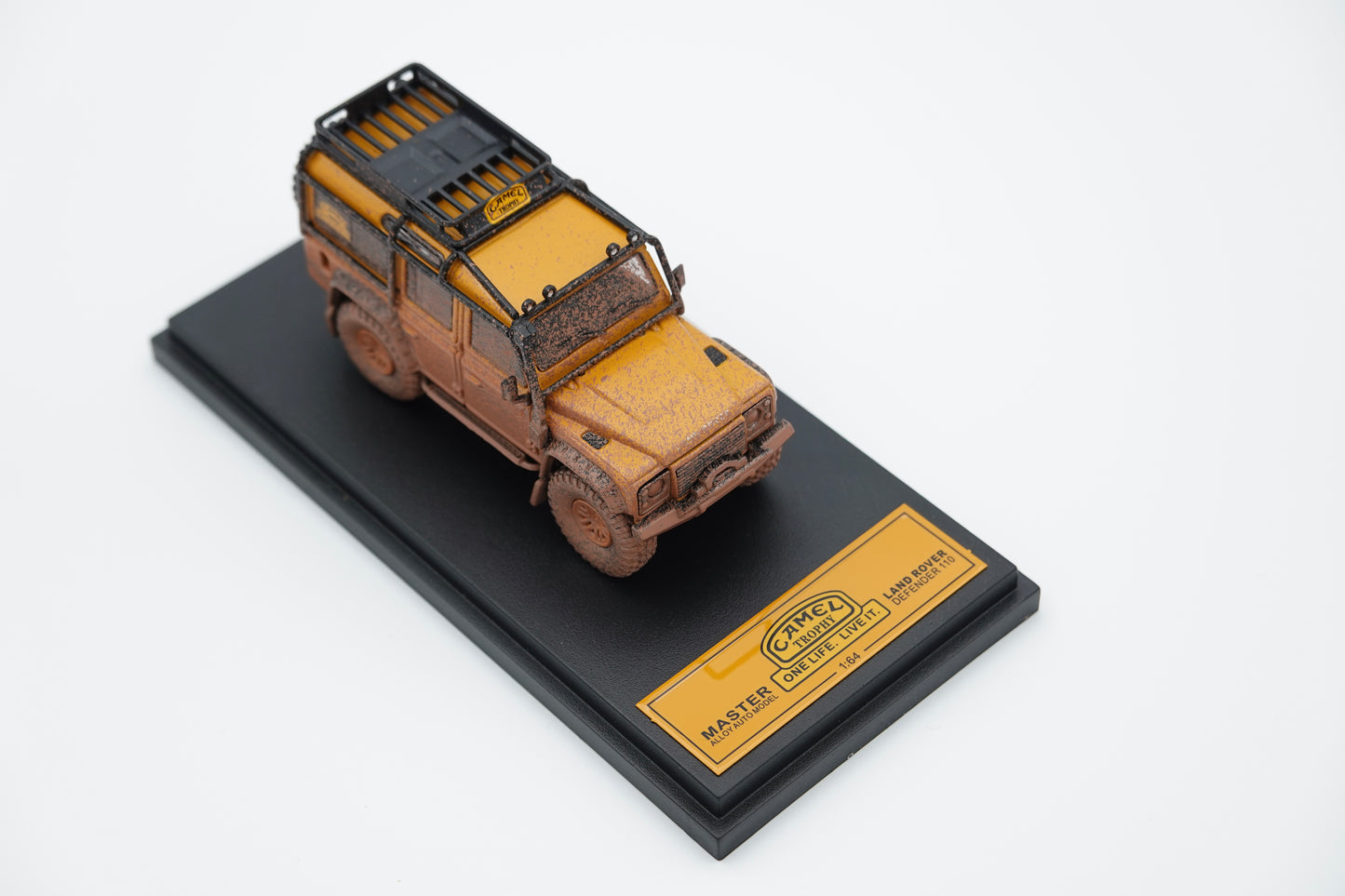Decode | LandRover Defender110 Camel Trophy Rally Dirty Version | 1:64